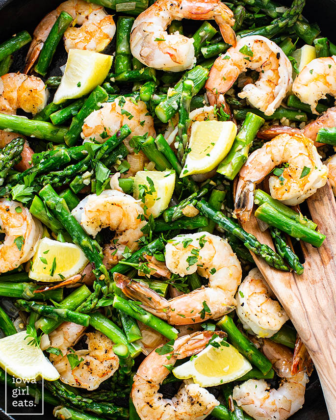 Close up of shrimp and asparagus in a pan