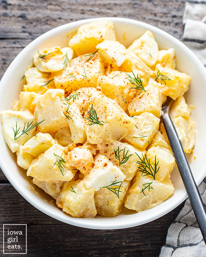 gluten free potato salad in a bowl with a fork