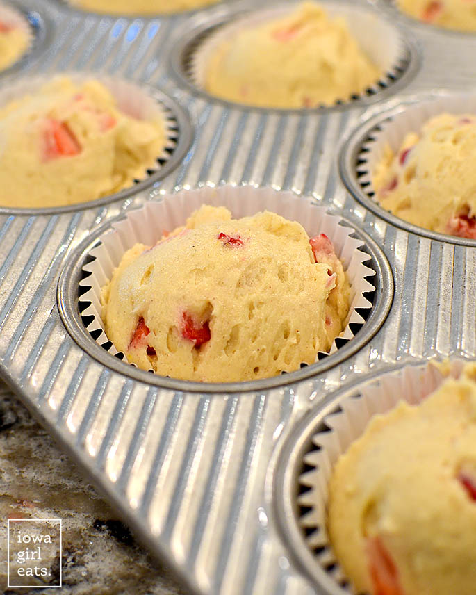 gluten free strawberry muffin batter in a muffin tin