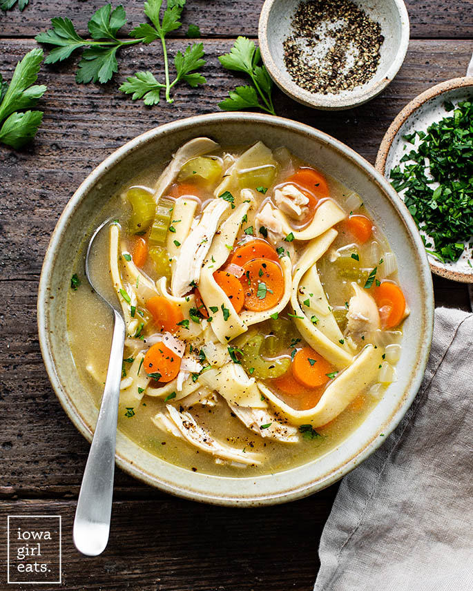 bowl of chicken soup with ،memade gluten free egg noodles