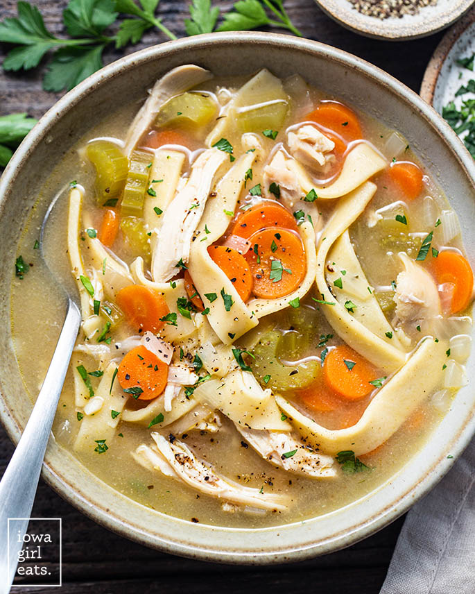bowl of homemade gluten free chicken soup with egg noodles