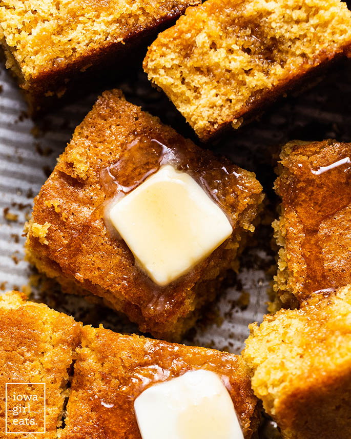gluten free cornbread squares with butter and honey
