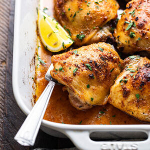 roasted chicken thighs in a baking pan