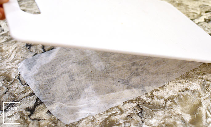 damp paper towel under cutting board to prevent slipping