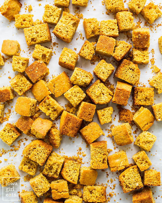 toasted cornbread cubes on a baking sheet