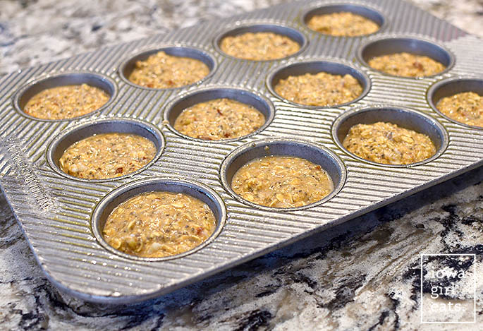 baked oatmeal batter in a muffin tin