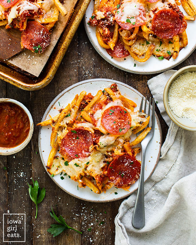 pizza fries on a plate with a fork
