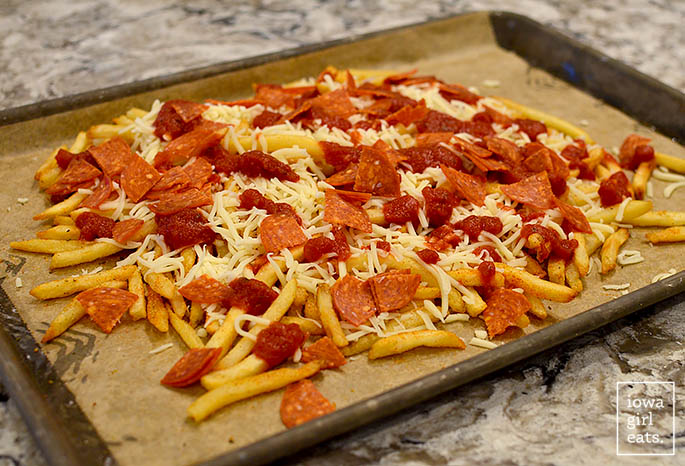 unbaked pizza fries on a baking sheet