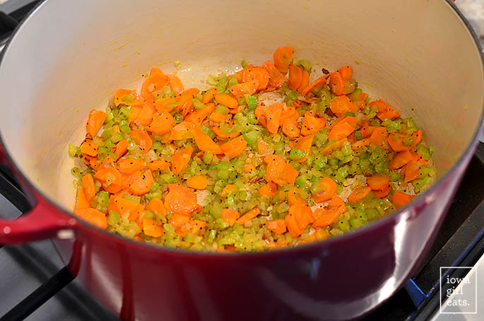 soup pot with sauteing carrots and celery