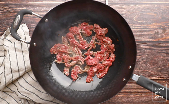 flank steak searing in a wok