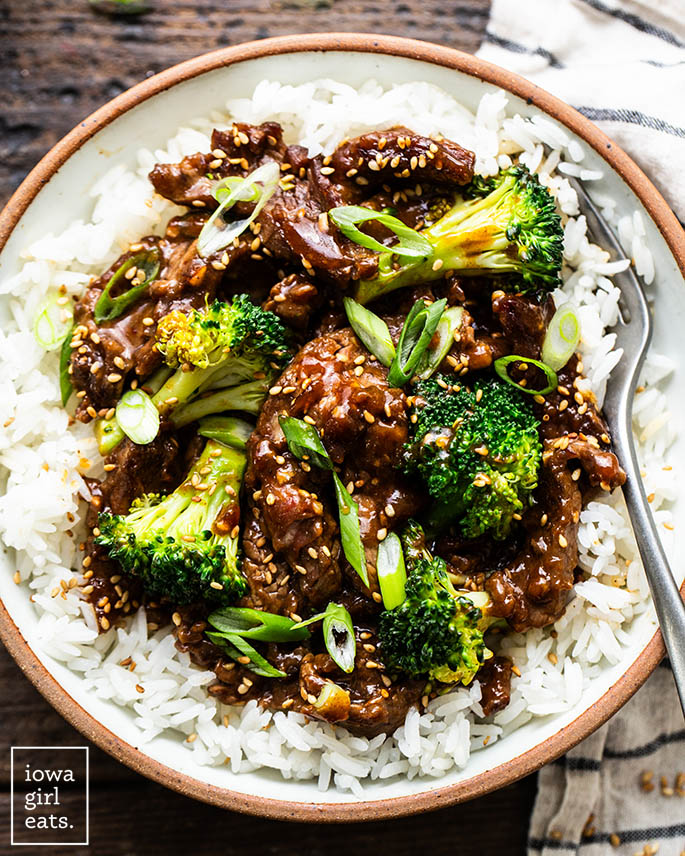 beef and broccoli on a plate with rice