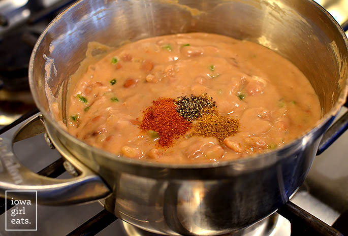 creamy pinto beans in a saucepan