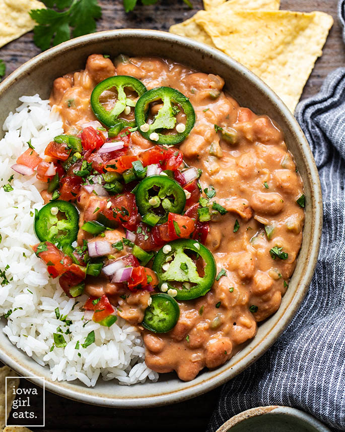 bowl of pinto beans and rice with salsa