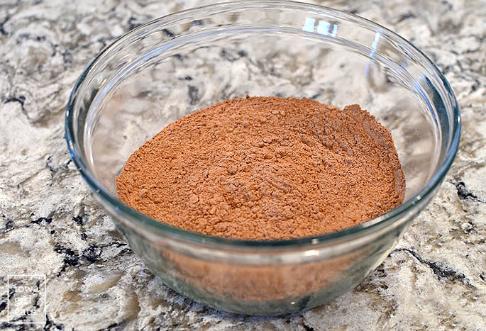 cocoa powder and gluten free flour in a mixing bowl