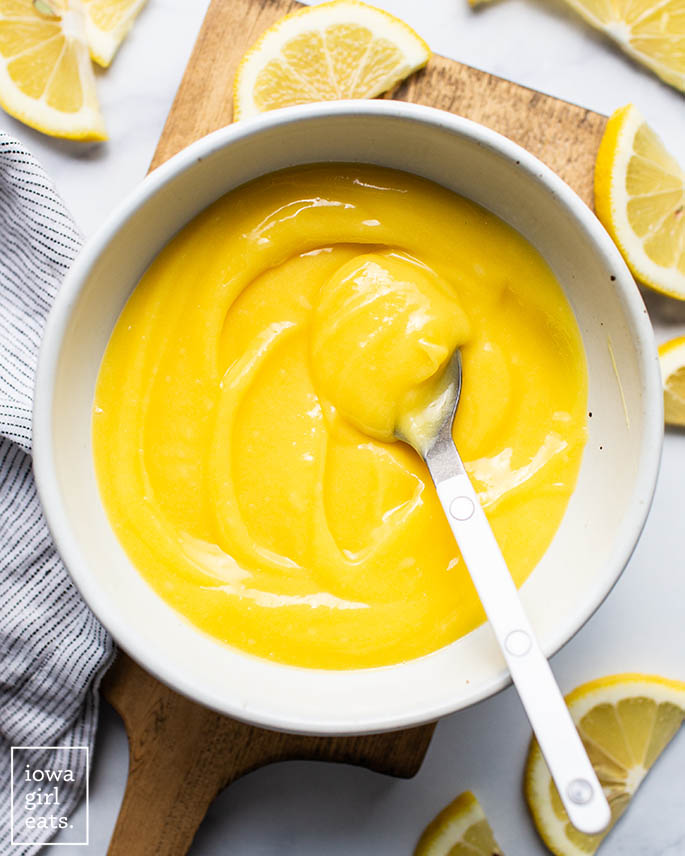،memade lemon curd in a bowl with a s،
