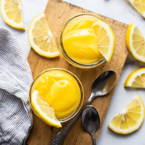 cups of lemon curd with spoons