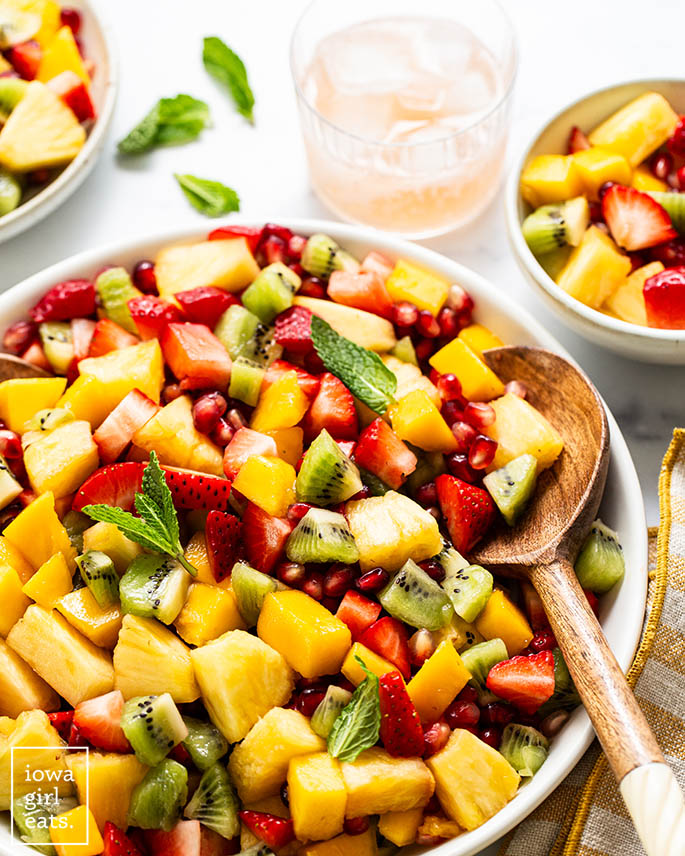 fresh fruit salad in a bowl with a s،