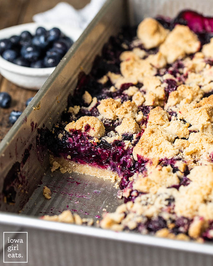 piece of gluten free blueberry pie bar cut from the pan