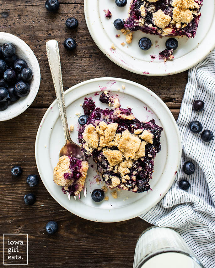 slice of blueberry crumble bar on a plate