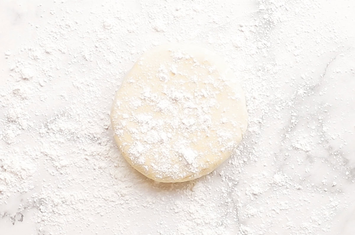 gluten free pie crust dough with flour on top