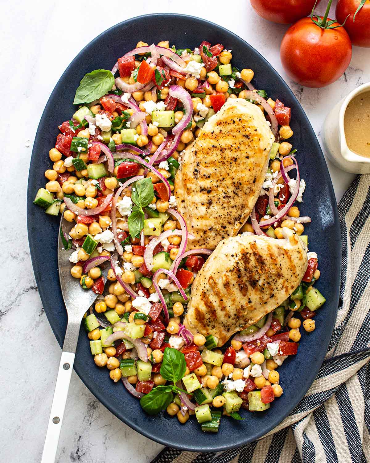platter of chickpea salad and grilled chicken