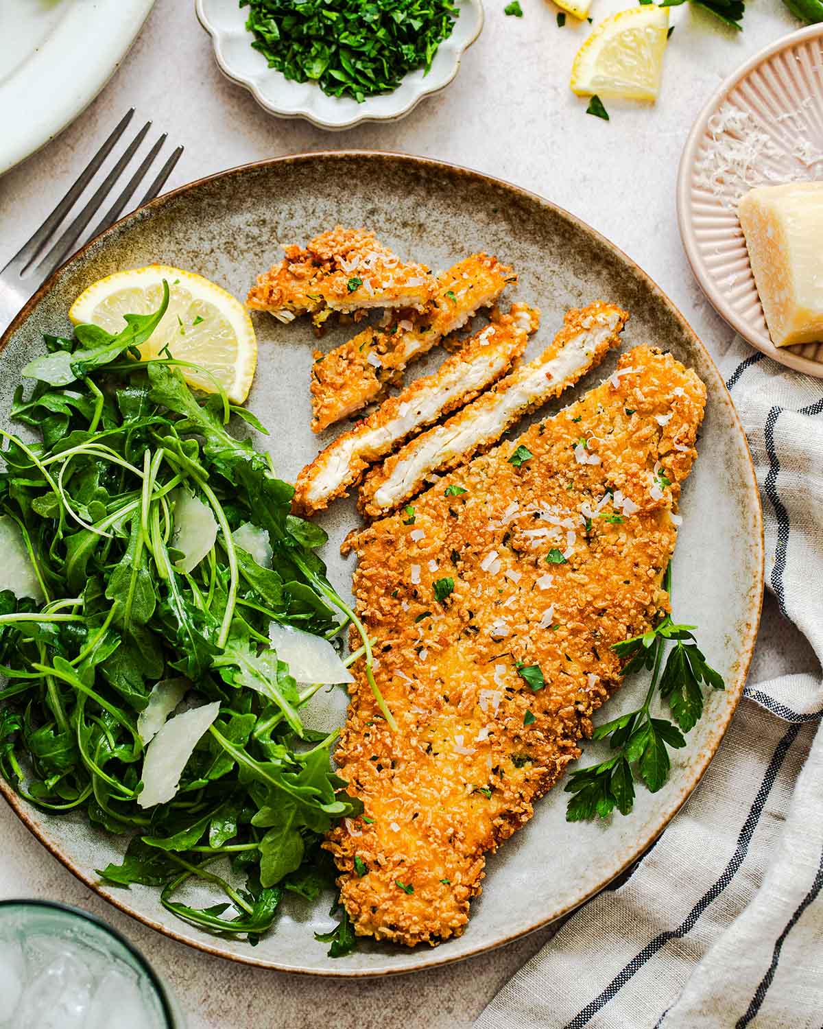 sliced gluten free chicken cutlet on a plate