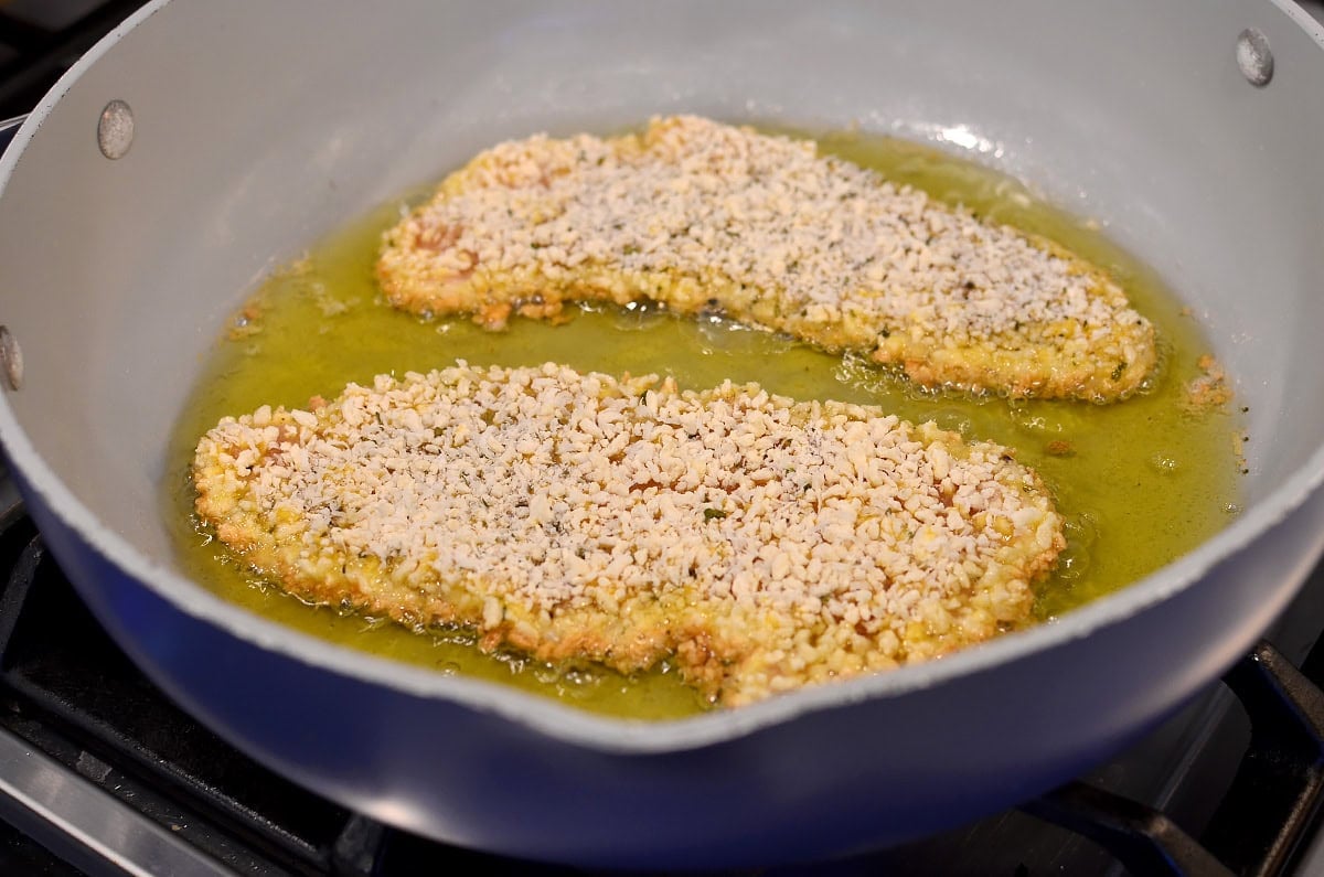 gluten free chicken cutlets frying in oil