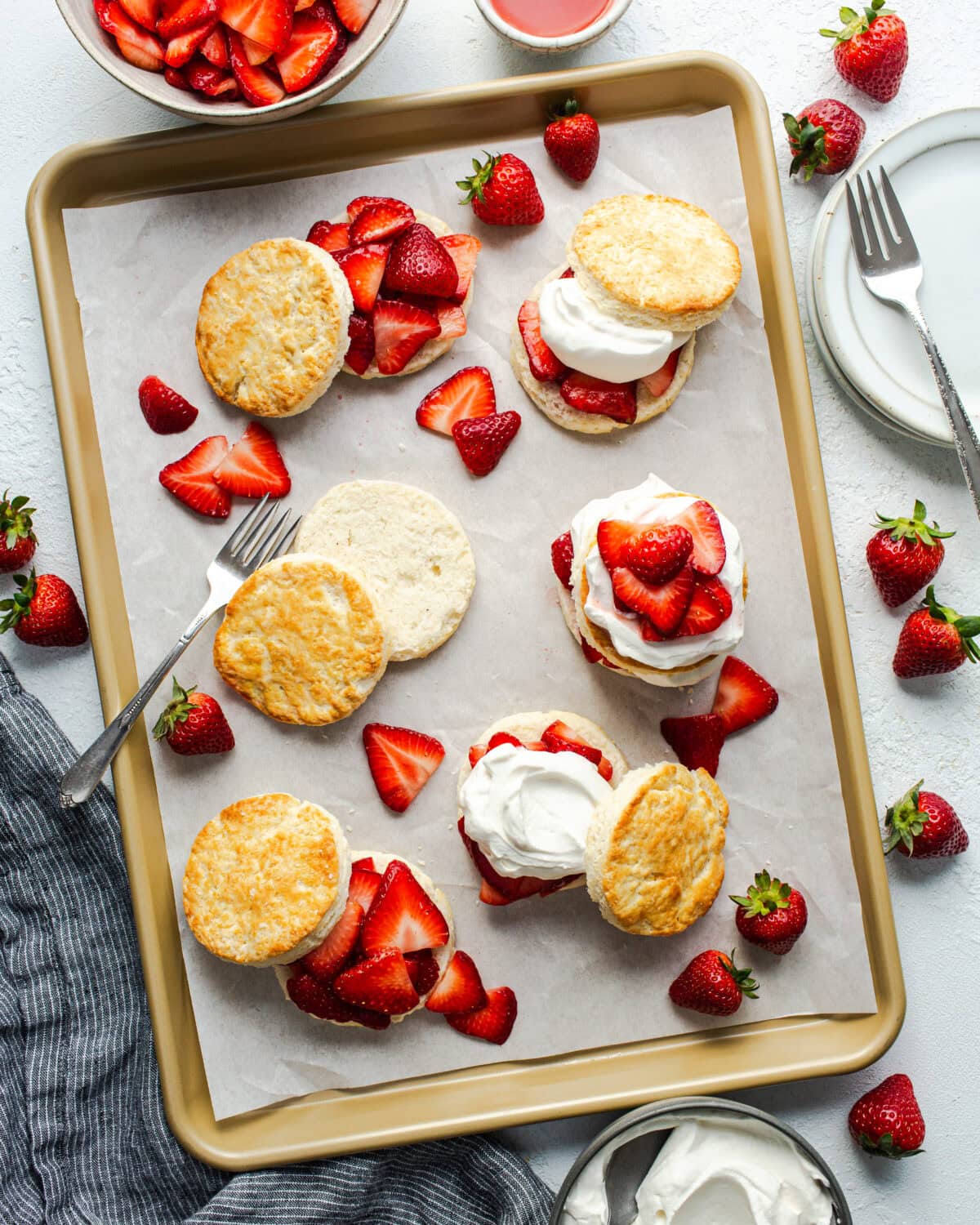 strawberry shortcakes being assembled