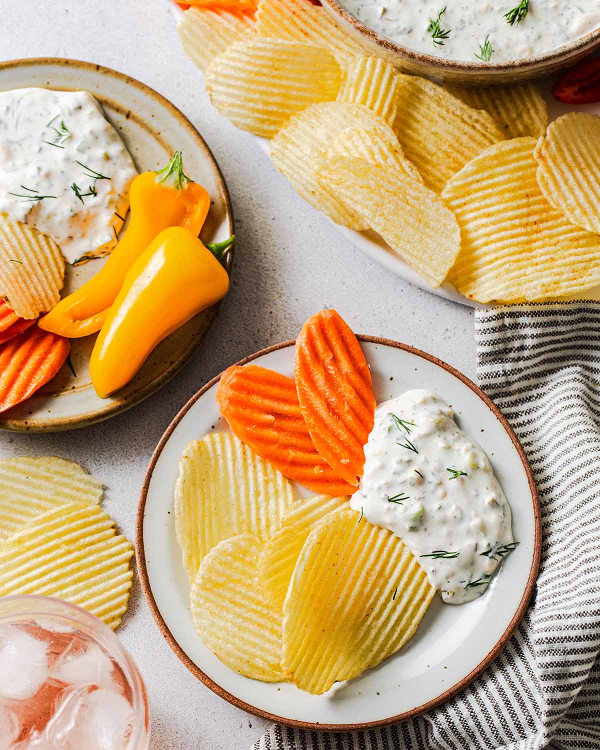 creamy pickle dip on a plate with dippers