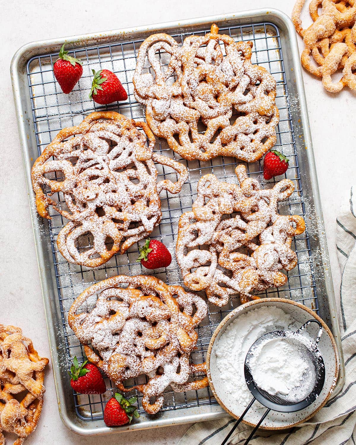 gluten free funnel cakes on a wire rac k