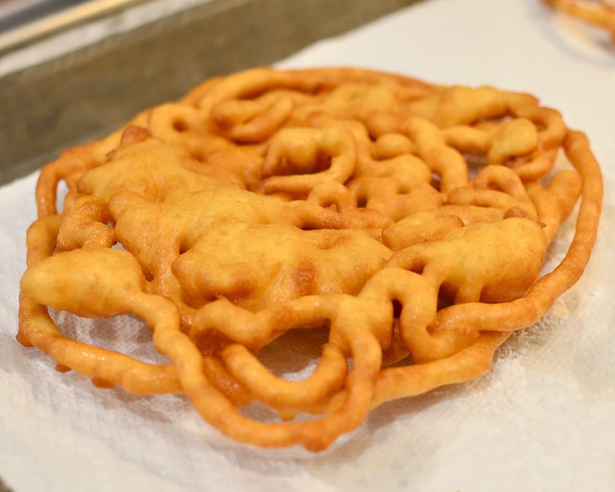 gluten free funnel cake on paper towels