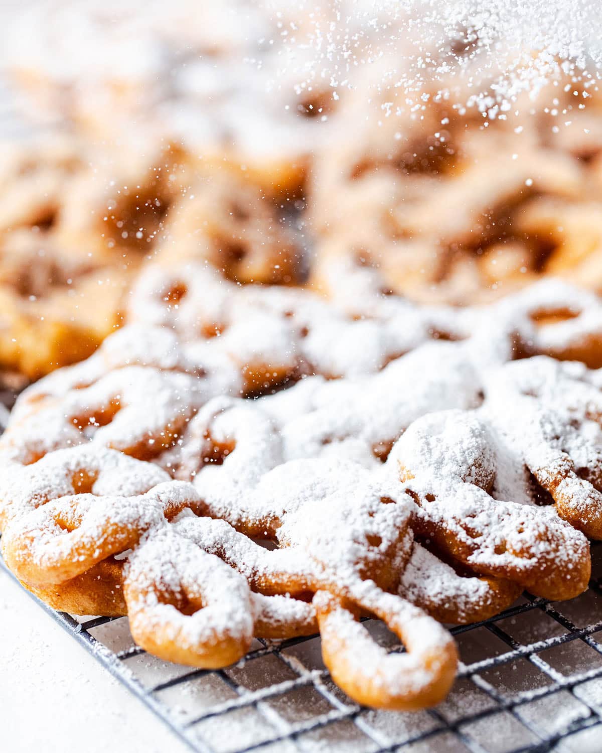 powdered sugar dusted gluten free funnel cake