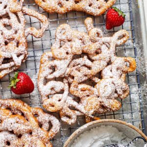 powdered sugar dusted gluten free funnel cakes