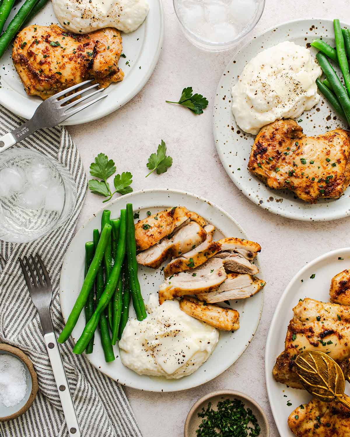 dinner plate with baked boneless chicken thigh and vegetables