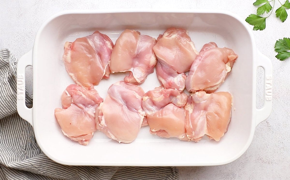 boneless chicken thighs in a cooking pan
