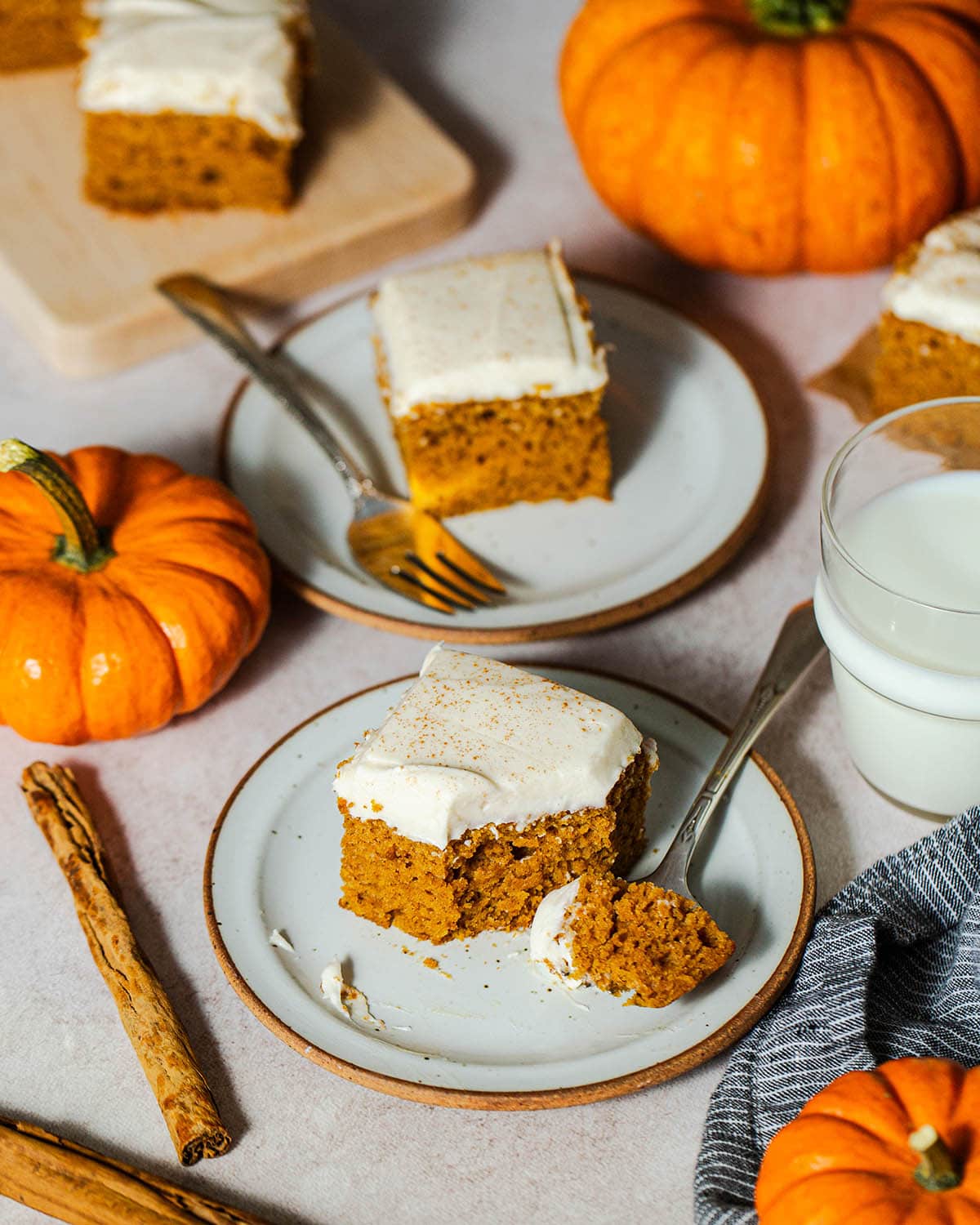 gluten free pumpkin cake bars on plates with forks